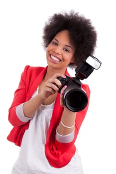 Young african american  photographer with camera, isolated on white background
