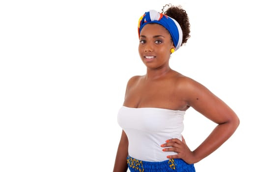 Beautiful african teenage girl wearing traditional clothes, isolated on white background