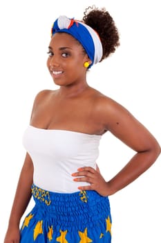 Beautiful african teenage girl wearing traditional clothes, isolated on white background