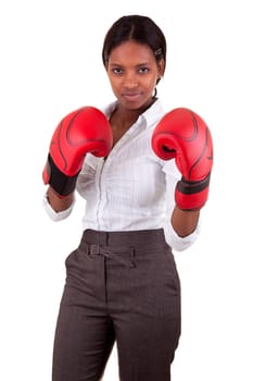 Young African American woman wearing boxing gloves