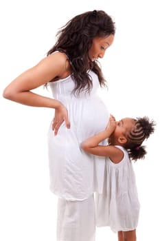 Pregnant black woman with her daughter
