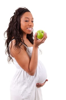 pregnant black woman eating an apple