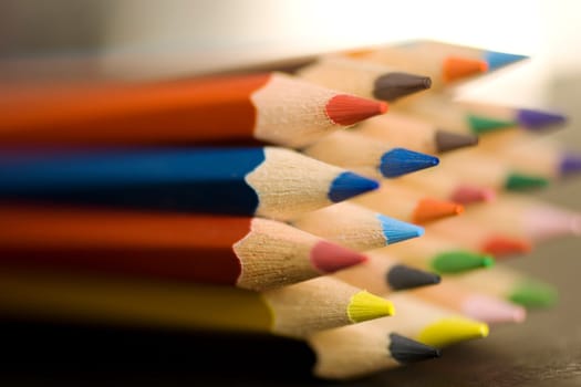 A lot of Colorful pencils on a black background
