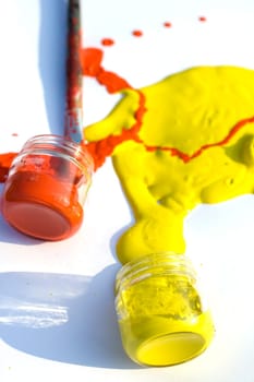 Photo of Yellow and red colors and paintbrush