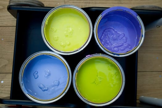 Four cans of various Colors