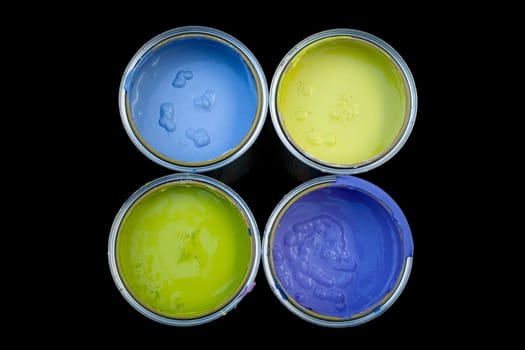Various Colors cans on a black background
