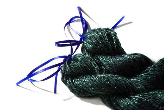 Handmade bundle of green yarn on white