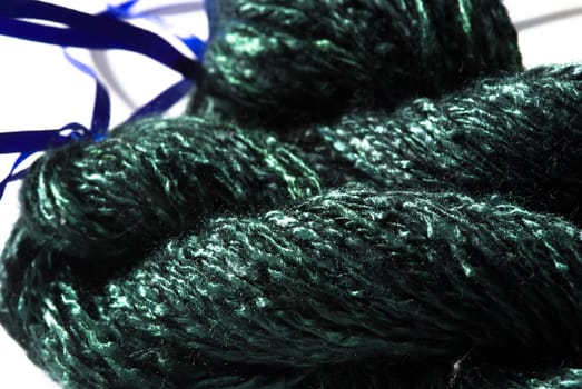 Handmade bundle of green yarn on white