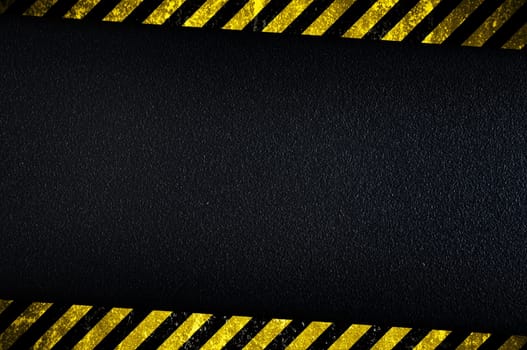 Grainy dark background with yellow caution stripes