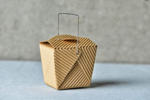 Image of a generic "to go"" box made of recycled brown cardboard"