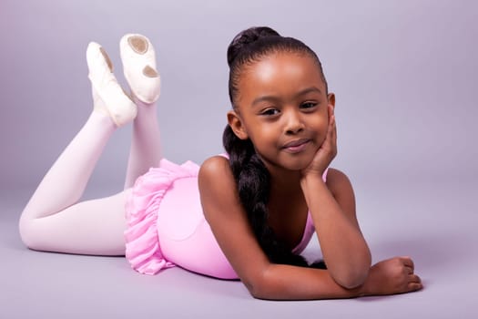 Portrait of a cute little African American girl wearing a ballet costume
