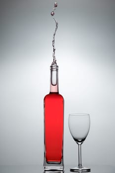 Liquid splashing from a glass bottle
