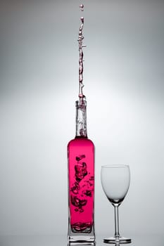 Liquid splashing from a glass bottle