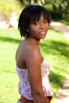 Outdoor portrait of a young african american woman in dress