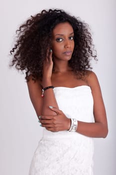 Portrait of a young beautiful African American woman with curly hair