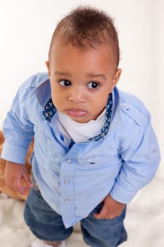 Portrait of a cute black baby isolated on white background