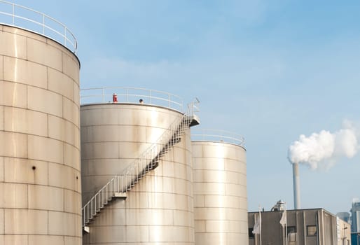 several petrol tanks for oil and gasoline in an industrial area