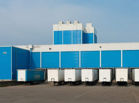modern blue warehouse with loading docks