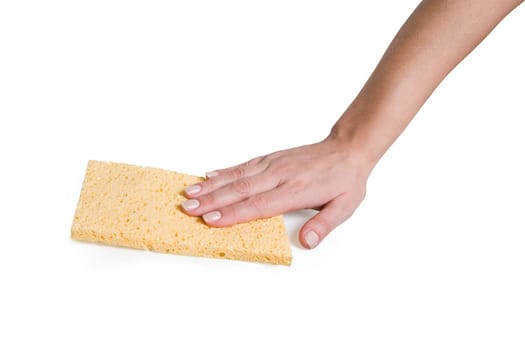 Female hand with a yellow sponge rag.