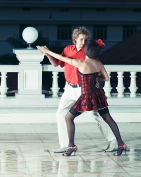 Couple dancing tango at the night time