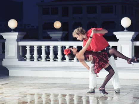Couple dancing tango at the night time
