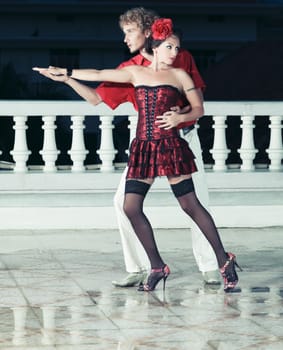 Couple dancing tango at the night time