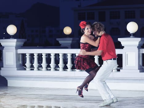 Couple dancing tango at the night time