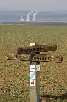 Signpost Lichtenhagen with Grohnde nuclear power plant
