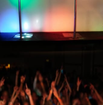 conceptual club stage and spectators for a pole dancer with copy space