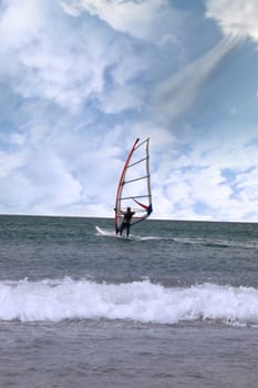 person windsurfing in the maharees in county kerry ireland during a storm with a gust of wind