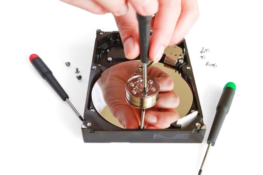Technical surgeon working on hard drive - data recovery concept