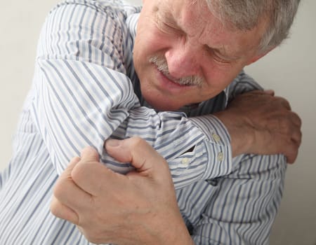 an older man suffering from sore joints