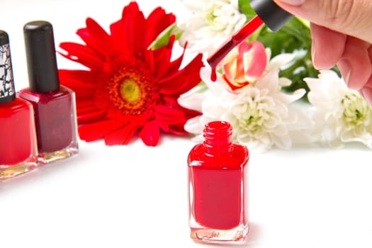 red nail polish with flower