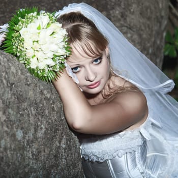 Beautiful young bride in wedding dress outdoor