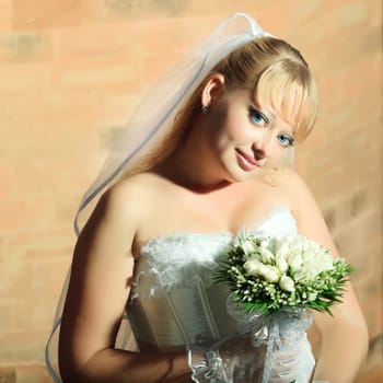 Beautiful young bride in wedding dress outdoor