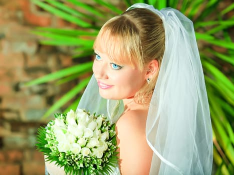 Beautiful young bride in wedding dress outdoor