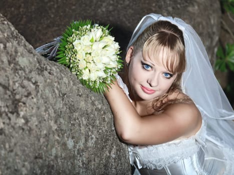 Beautiful young bride in wedding dress outdoor