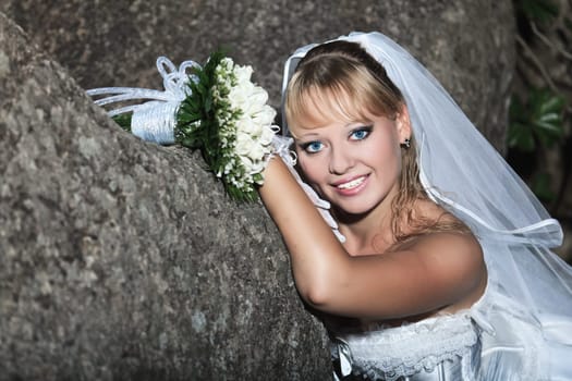 Beautiful young bride in wedding dress outdoor