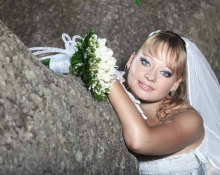Beautiful young bride in wedding dress outdoor