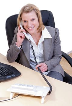 Young woman in office talking on the phone
