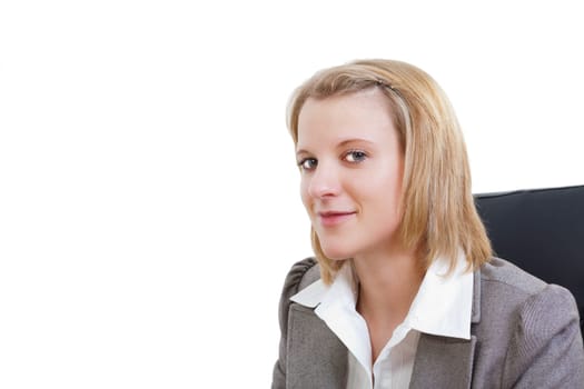 Young businesswoman smiling in office chair