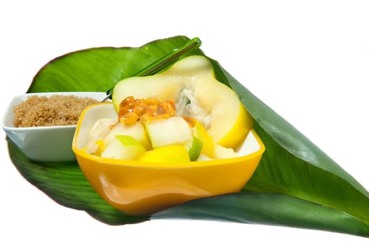 salad with tropical fruits on white background
