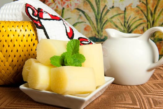 dish with pieces of natural sugar cane