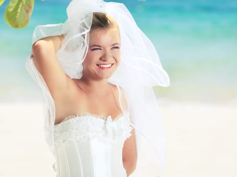 Beautiful young  bride on the tropical beach