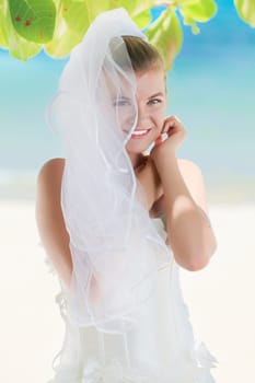 Beautiful young  bride on the tropical beach