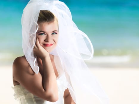 Beautiful young  bride on the tropical beach