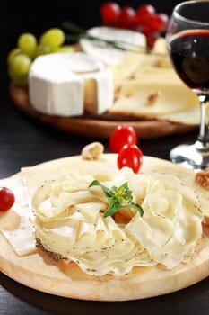 Cheese and salami platter with vegetable and herbs