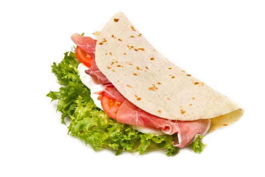 italian piadina with ham, fresh salad and mozzarella cheese