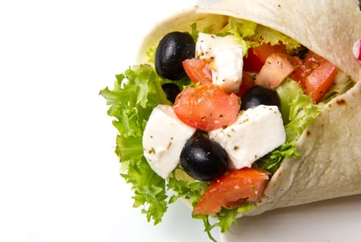 vegetarian piadina with fresh salad, tomatoes, olives and mozzarella cheese