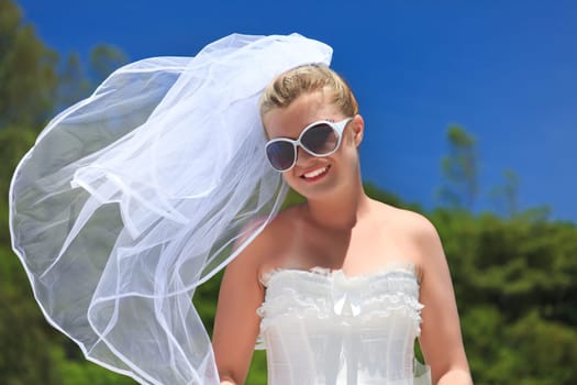 Beautiful young  bride on the tropical beach